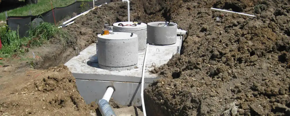 Septic system repair and installation site with tank access ports in Redding, CA