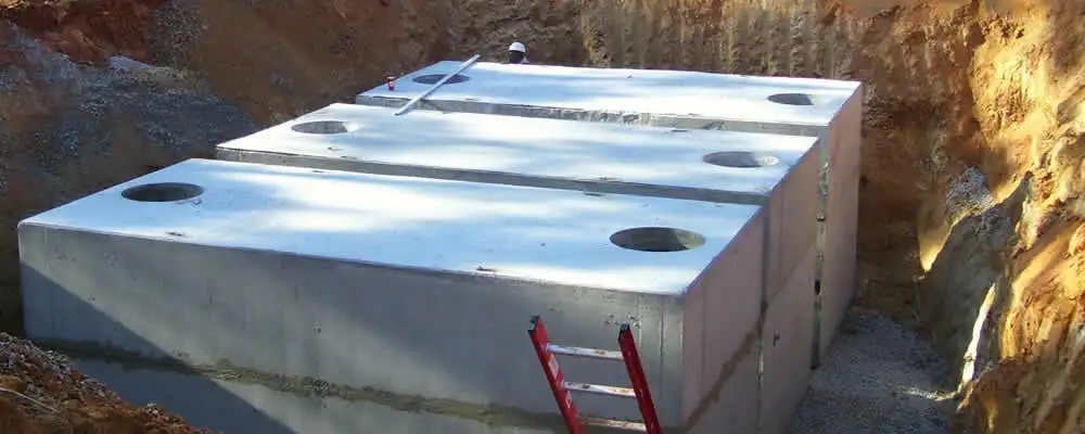Septic tank installation site with a newly placed concrete tank in Redding, CA
